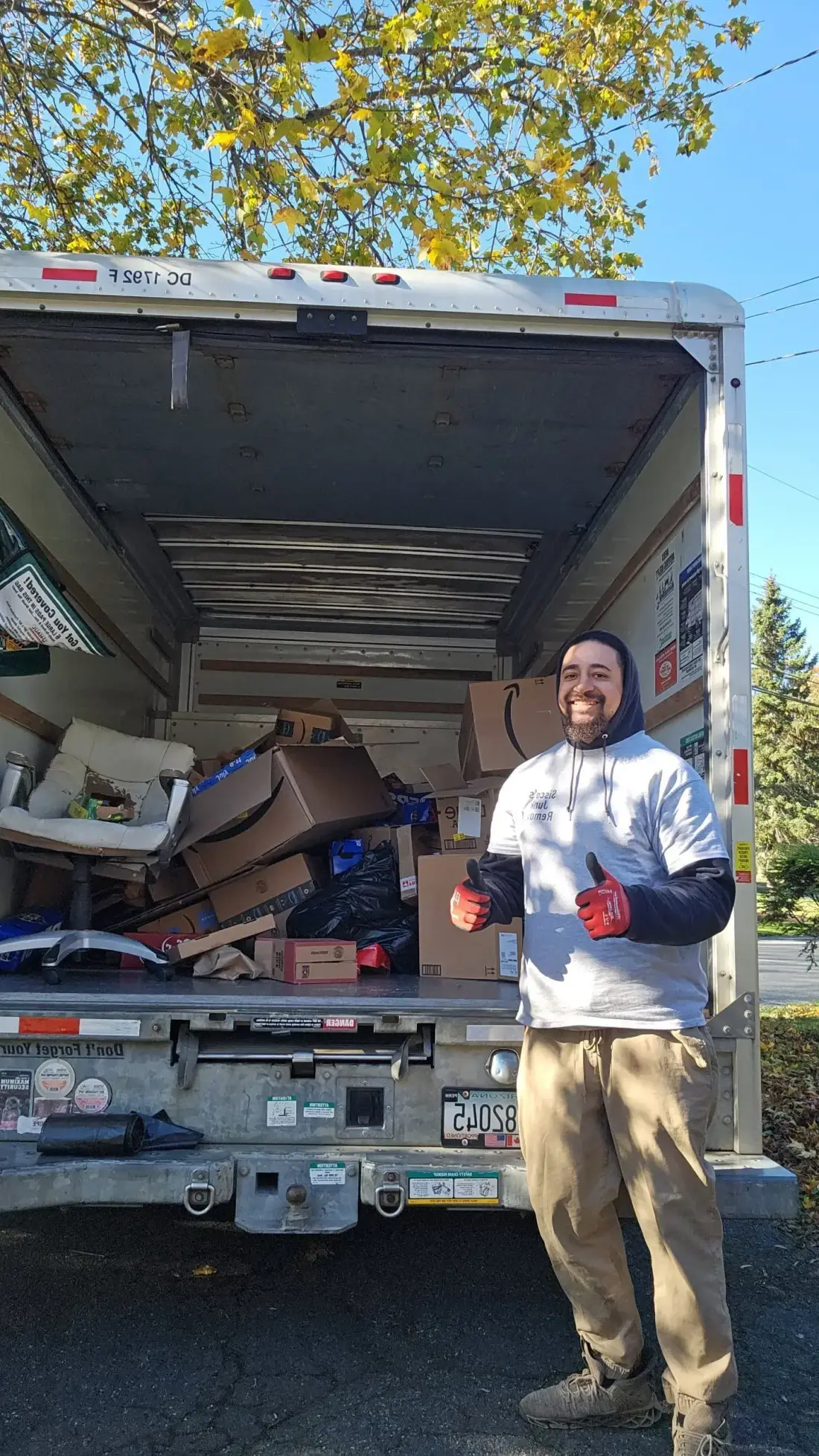 A smiling Sisco team member ready to help with a removal job